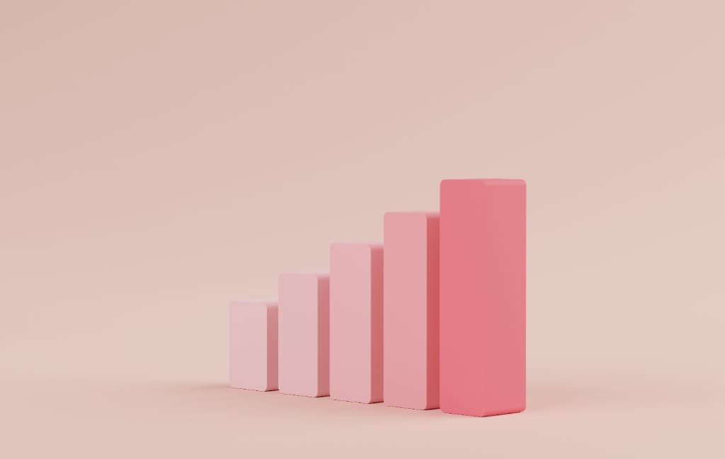Minimal 3D bar chart rising in pink tones symbolizing SEO growth